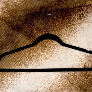 100 black, sturdy, velvet hangers. Perfect for boutique owners.